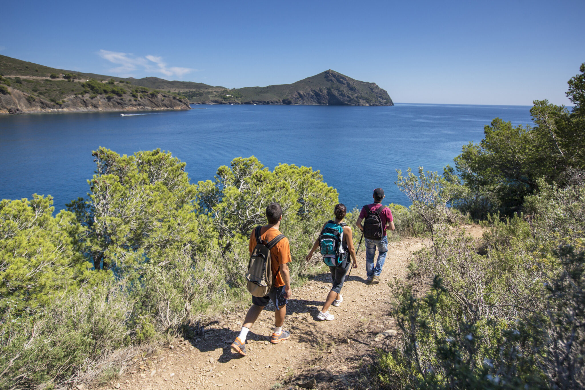 People hiking in the Mediterranean coast.